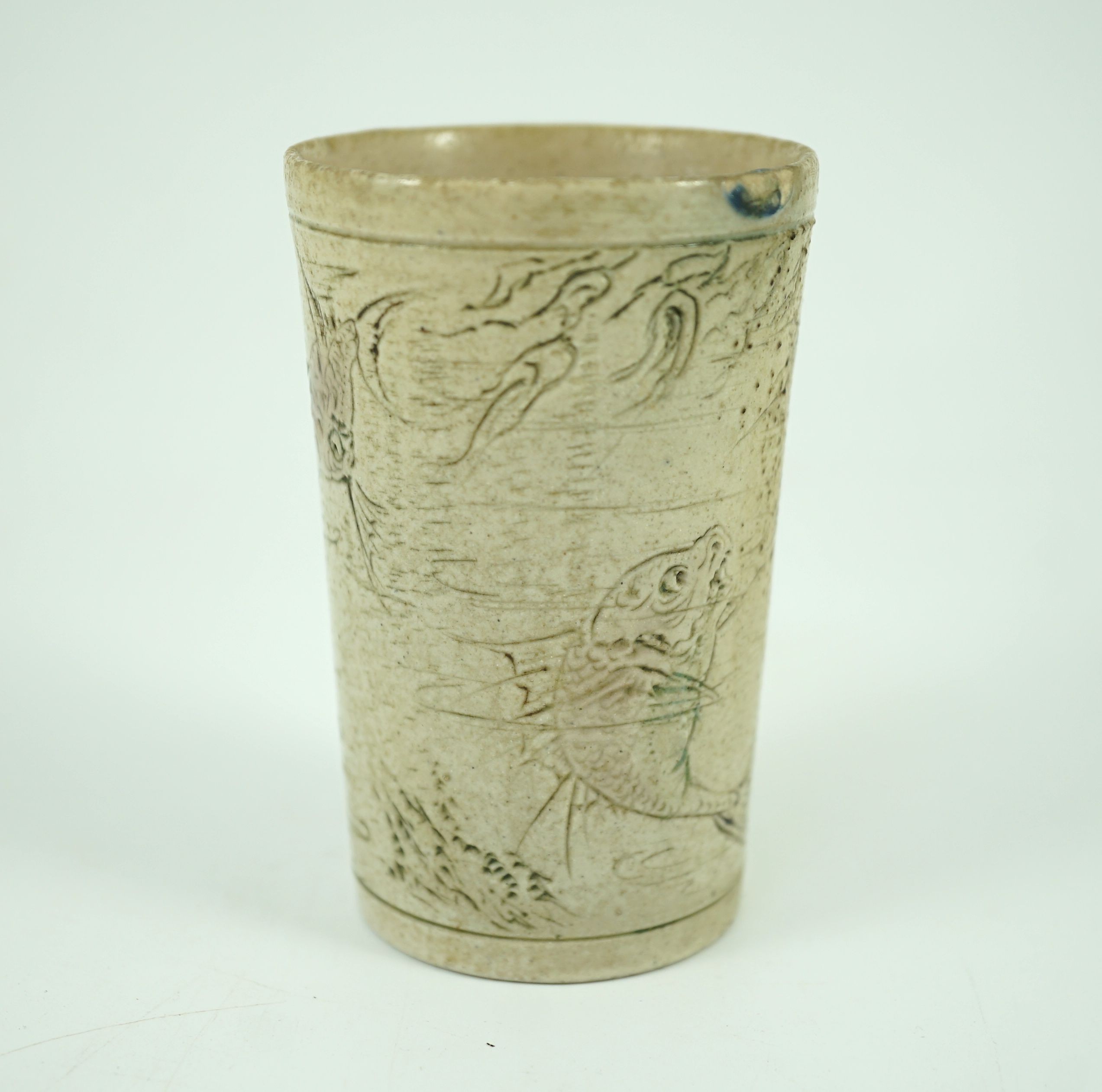 A Martin Brothers ‘grotesque fish’ beaker, dated 1914, 8.7cm high, hairline crack